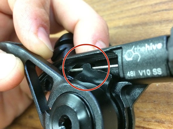 Be sure the cable passes through the hole in the small aluminum block