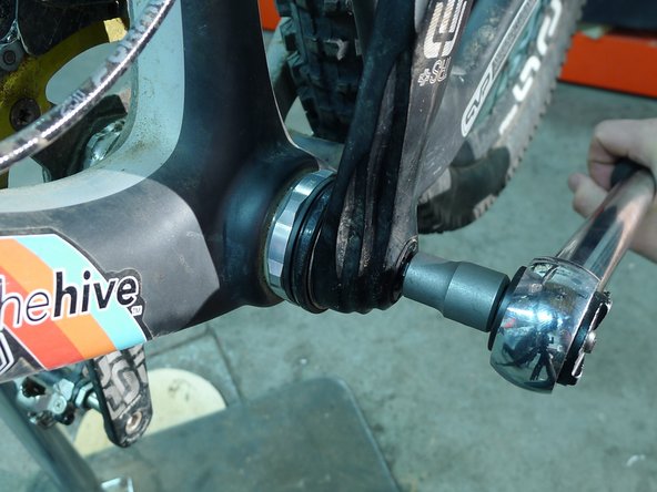 Install the non-drive arm using a 8mm hex wrench