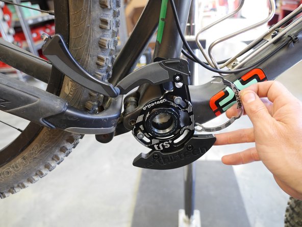 If needed, use the provided ISCG05 C-spacers or washers to move the guide out from the frame until it is centered over the guide