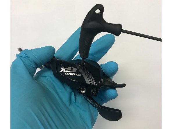 Install the new shifter cable provided with the kit and give the larger thumb paddle a few clicks while watching the ratchet turn to ensure everything is functioning properly. Use the smaller paddle to click back down into the relaxed postion.