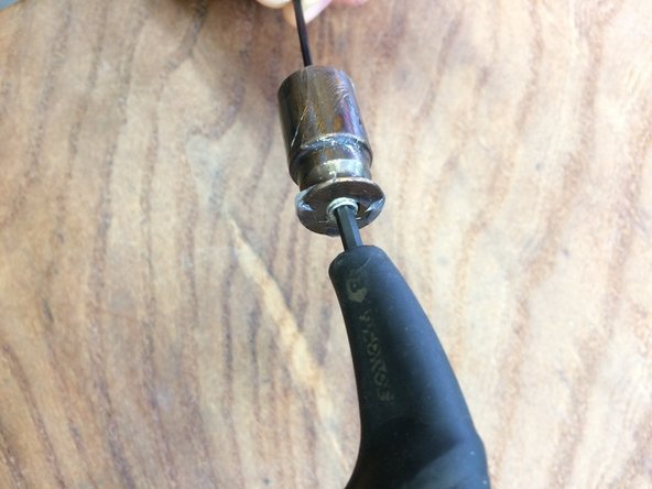 You may need to clamp the cam in the soft jaws to loosen the set screw. Be careful not to mar the cam or cam bushing