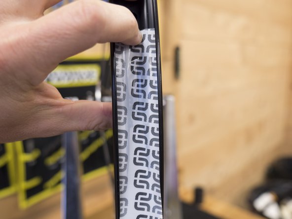 Press the first 10cm of tape down into the rim valley to make sure it is well attached to the rim.