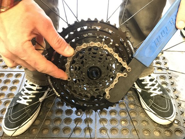 Using a chainwhip, turn the steel sprocket assembly clockwise to lock it in place.