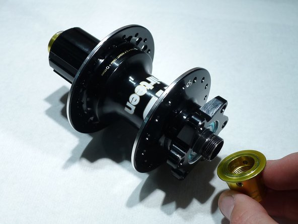 Use cone wrenches as needed, but often this can be done by hand