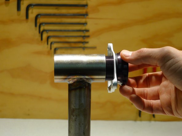 For either mounting, start with the cranks off of the bike