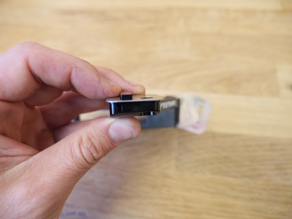 Add the silver spacers behind the T-spacer to center the slider over the chainring as needed