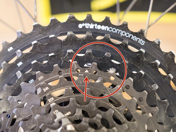 Line the key on the steel sprocket assembly up with the lock arrow on the aluminum cogs to ensure the two pieces are fully locked together.
