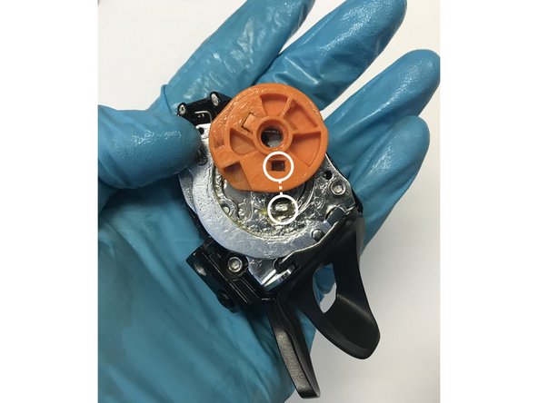 X1™ and XO1™ shifters will have a small washer under the spool. GX™ shifters do not have this washer. Remove the washer if present and set aside. When installing the 12s parts, you will use the washer included in your kit.