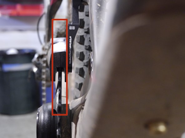 Close the upper slider and sight down the front of the guide and chainring