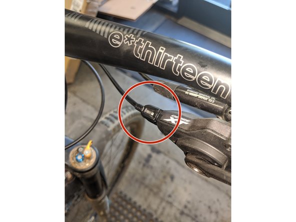 Sight down the back of the bike to see if the chain needs to be adjusted in towards the wheel (turn barrel counter-clockwise) or out (turn barrel clockwise)