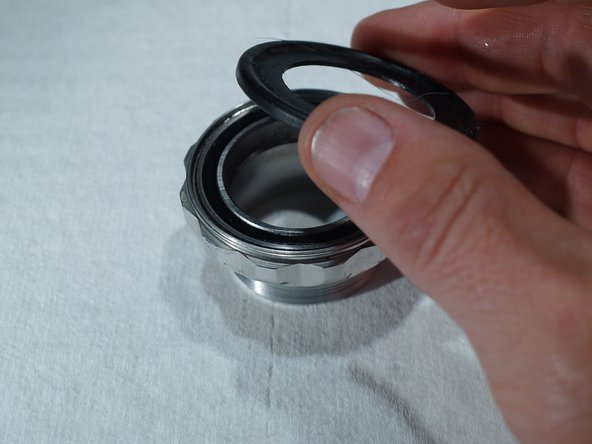 The BB does not need to be removed from the bike to do this service, but it is a good idea to remove and re-grease the BB threads at the same time