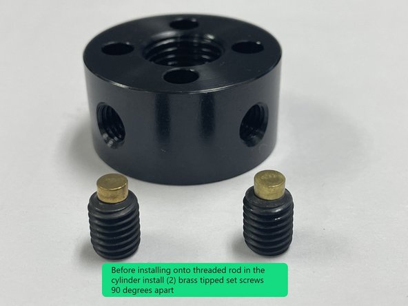 Before installing the lower clamp nut and spring washer onto the threaded rod in the cylinder install 2 brass tipped set screws into the nut 90 degrees apart.