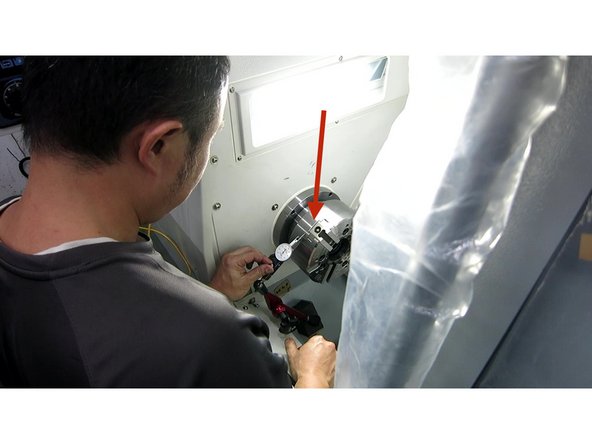 Set up a 0.0001&quot; dial indicator on the chuck and measure the runout. The runout on the perimeter and face should be less than .0002&quot; (5um). Tighten the six(6) mounting screws  in a crossing pattern (same as in previous step) while watching the runout. Verify the runout stays in spec while tightening the screws. Torque to 58ft-lbs.  See Photo 1