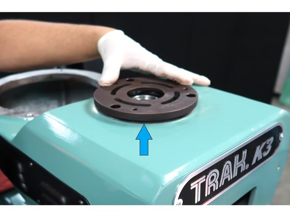 Press the bearing back into the bearing cap and then press it back on the machine.