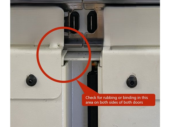 Open and close both doors a few times. They should move full travel with no roughness or binding.