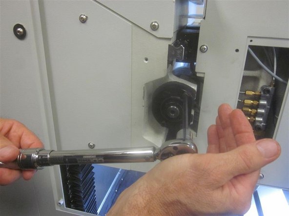 Install the cushion on the LH side of the casting. Rotate the ball screw moving the spindle all the way to the LH side, but not against the cushion. Tighten the four (4) screws on the LH bearing housing. Torque to11 ft. lbs.