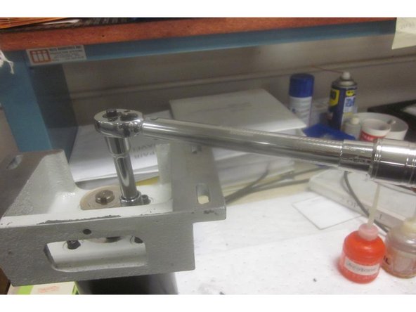 Clean any Loctite or debris from the screws. Swap over the mounting bracket to the new motor orientating the bracket as shown.