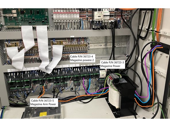 Install cable 36723-5 to Q23 and wire as shown in the wiring chart in Photo 2. Then  route it out through the electrical cabinet and join it with the cables from the previous step. See Photo 3 for cable routing.