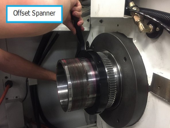 Install rear inner bearing on spindle and slide until it is firmly up against the inner race of the bearing.