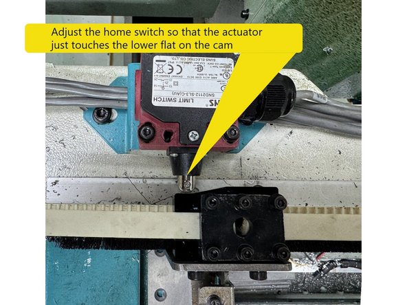 Adjust the home switch so that the actuator  just touches the lower flat on the cam. See Photo 3
