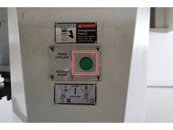 Before moving the arm, it is best practice to put some cardboard and/or rags onto the table of the machine, in case the tool falls from the spindle.