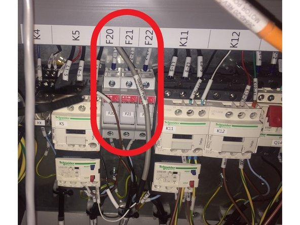 Using 2 M10 eye bolts, a strap or chain, and a crane remove the head stock cover.