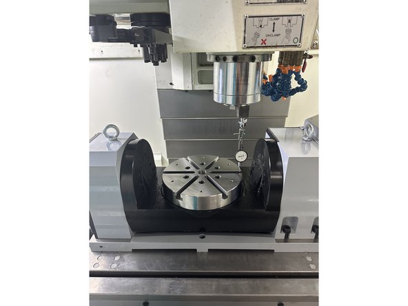 Tilt the A-axis in fine increments until the dial indicator is midway between the start and end readings.