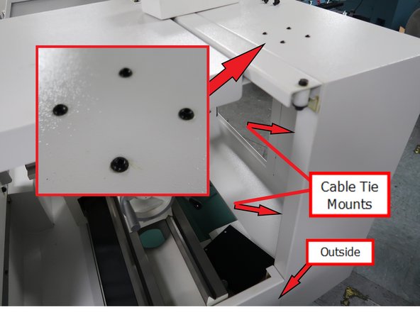 Location for the Work Lamp 26223. SHCS will be removed and replaced. Lamp is mounted here inside the lathe upside down using these holes. Two Cable Tie Mounts are installed inside channel on the inside surface to hide from view. The cable is then routed outside the lathe as shown.