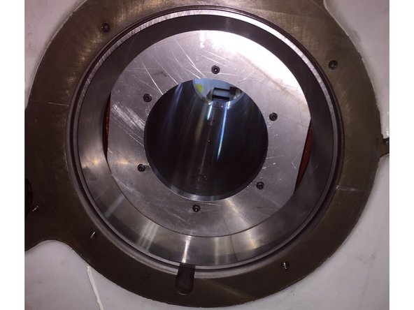 Using the Z axis handwheel in DRO slowly start to move the spindle out of the head stock to remove the rear bearing from the spindle. Once the spindle has moved back far enough that the rear bearing is free, remove the rear bearing, high/ low gear lock nut and spacer.