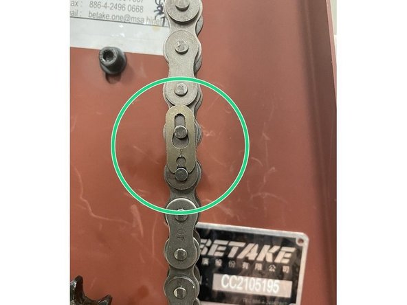 Once the tension has been removed from the chain locate the master link on the chain and remove it then remove the chain from the sprockets.