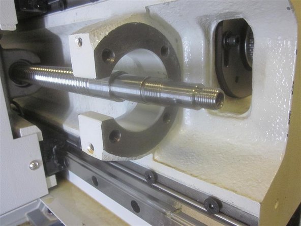 Install the roller bearing in the housing and slide it on the end of the ball screw. It has a precision fit and may require a &quot;tap&quot; to seat it against the ball screw shoulder. Install and tighten the ring nut. Tighten the set screws.