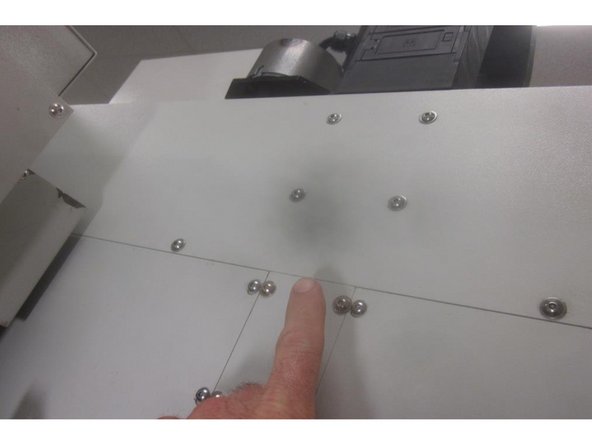 Jog the Z axis up and down and check for any binding of the ball screw cover.