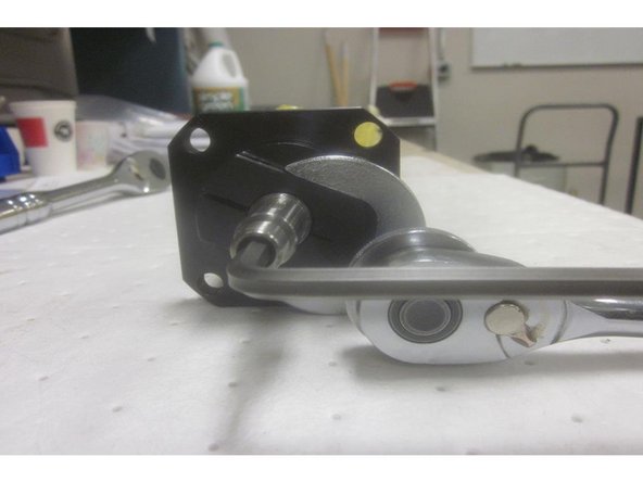 With the ball screw removed from the machine, lay it on a flat surface. Loosen the two (2) small set screws holding the square (rotor hub) on the top end of the ball screw. Tap off the hub, remove the key and set aside. Use care working with this part. If damaged, it will require purchasing a complete brake assembly.