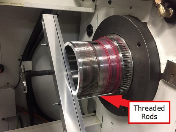 Install 31093-2 gear puller crossbar to back of spindle with (2X) M5x18 SHCS. Attach 31093-5 gear puller pullbar and thread in the (2X) M5 threaded rods, using hex nuts to thread them into the encoder pulley.