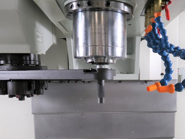 Use the alignment bar to make sure the spindle is aligned with the ATC arm on both sides.