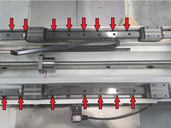 Wedge blocks are located along the outside edge of the linear rail. Remove all wedge blocks from front and Rear Linear Guide rails.