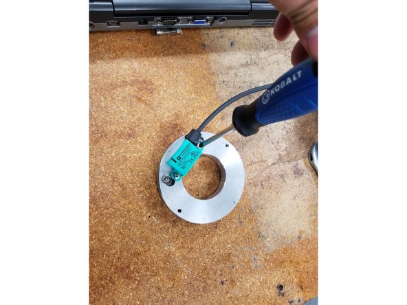 Install the new Encoder to the Plate and tighten the mounting screws securely.