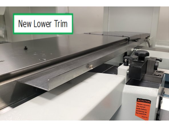 Replace it with the shorter of the two cross slide sheet metal parts provided. Detail shows two screws are installed on the bottom. The outside edge gets three screws to eventually connect with the upper cross slide sheet metal.