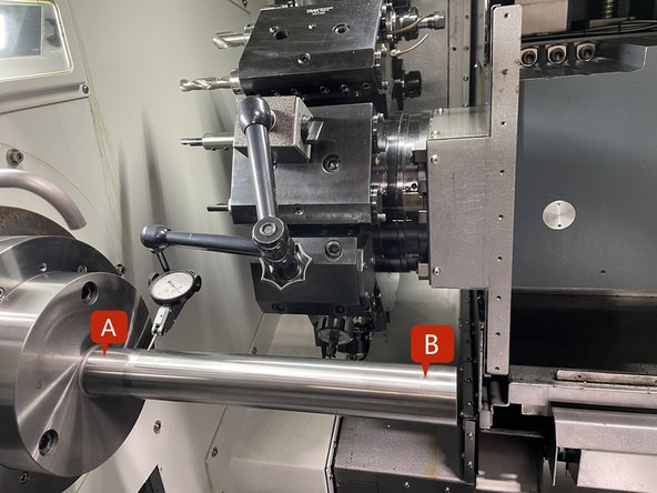 The two screws on the base casting, depicted by the circles in the center of the row, will push the Spindle, while the two screws depicted by the circles on the outside of the row will pull the Spindle. This motion will cause the Spindle to rotate so it can be aligned. See Photo 1
