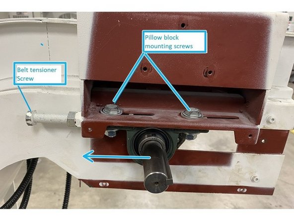 With the sheet metal cover from behind the sprockets removed, you now have access to the pillow block mounting screws and belt tension adjusters. Loosen the pillow blocks and belt tension jam nuts, then loosen the adjusters so that there is no tension being applied to the belt. Push the belt towards the chute to release all tension in the belt.