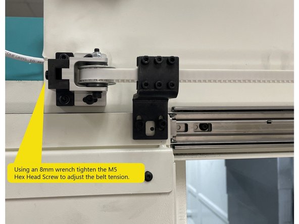 Using an 8mm wrench tighten the belt adjustment screw (M5 Hex Head) until the belt tension reads 50Hz +\- 2Hz on the Bando Meter when the belt is plucked. Then tighten the two(2) M5 screws.