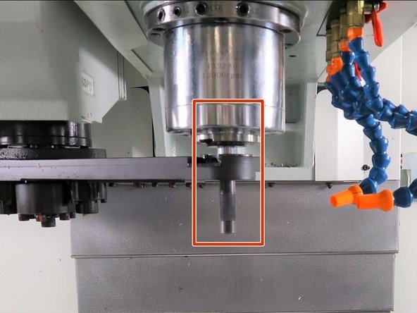 Using the push and pull screws for the X and Y  ATC movement, position the arm so the alignment tool holder and alignment disk are concentric and the alignment bar can slide between the two easily.