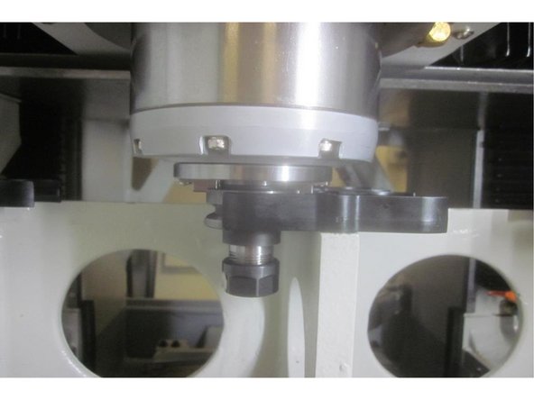 Using the hand wheel, highlight the &quot;Z Tool Change&quot; number. Place a tool holder in any location. Jog X and Y to match the coordinating tool location numbers. Press the &quot;Orient On&quot; key. Press the &quot;Unclamp Tool&quot; key. Slowly lower the Z axis engaging the drive dogs until the air from the spindle just stops. Raise it until it just starts.