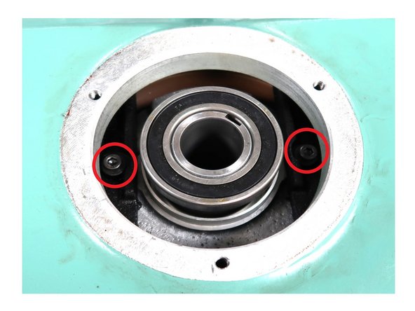 Locate the 2 SHCS below the bearing plate.