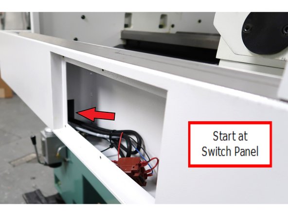 Start at the switch panel and run the control cable through this opening.