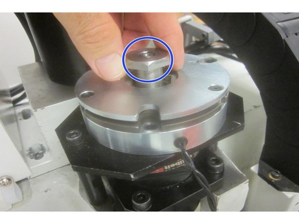 Remove the brake cover. Disconnect the brake wire. Remove brake plate mounting screws and standoffs. Remove the nut, lock washer and coupling bushing. Remove the brake assembly and belt.