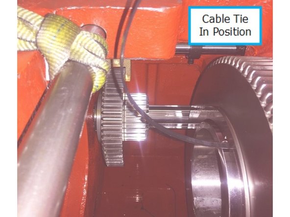 Take caution when removing low gear, low gear weighs approximately 50lbs. A crane could be used to hook through the cable tie to aid in the removal and installation of low gear.