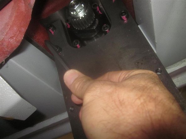 Install the motor plate. Note the position of the oil line (located in the upper right corner). Be careful not to pinch the line, or the plate may not align itself. Tighten securely.