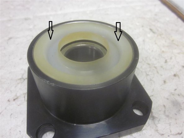 Install the angular contact bearings, spacer and seal. The bearings should be installed &quot;back to back&quot; as shown. Be sure the spacer is installed in between the bearings and the seal is installed correctly. The seals open side faces out.