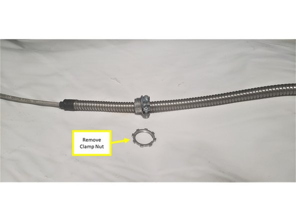 Next, connect the Logic Adapter Cable with the Turret Logic Cable itself. Begin by removing Cable Clamp Nut from the Turret Logic Cable.
